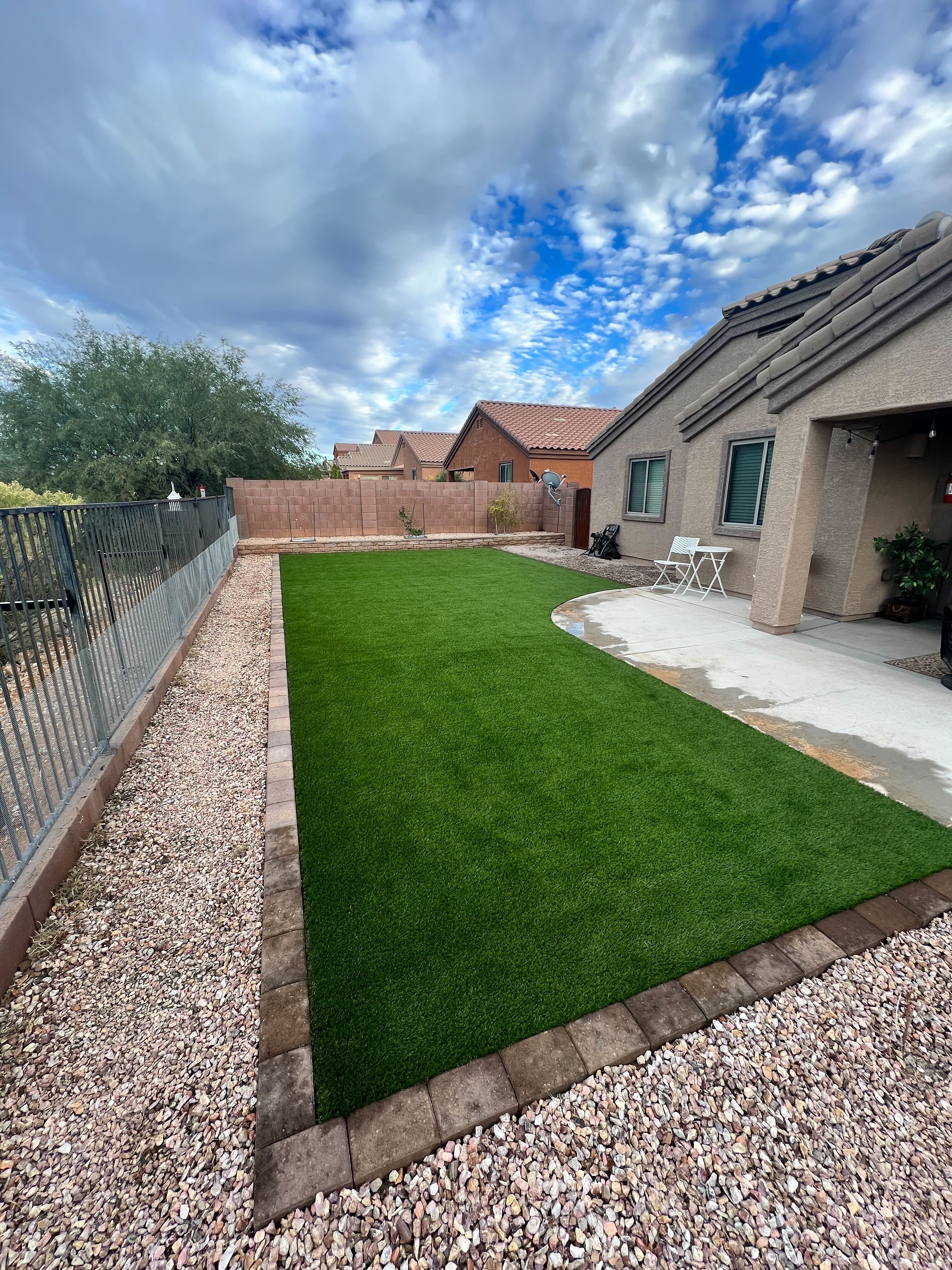 Backyard artificial turf installation