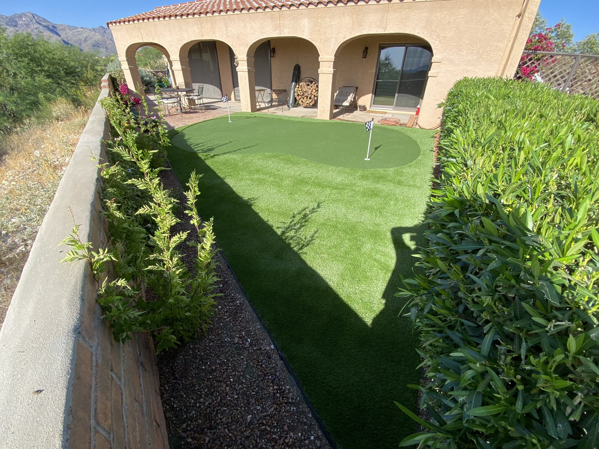 Custom putting green with mountain backdrop