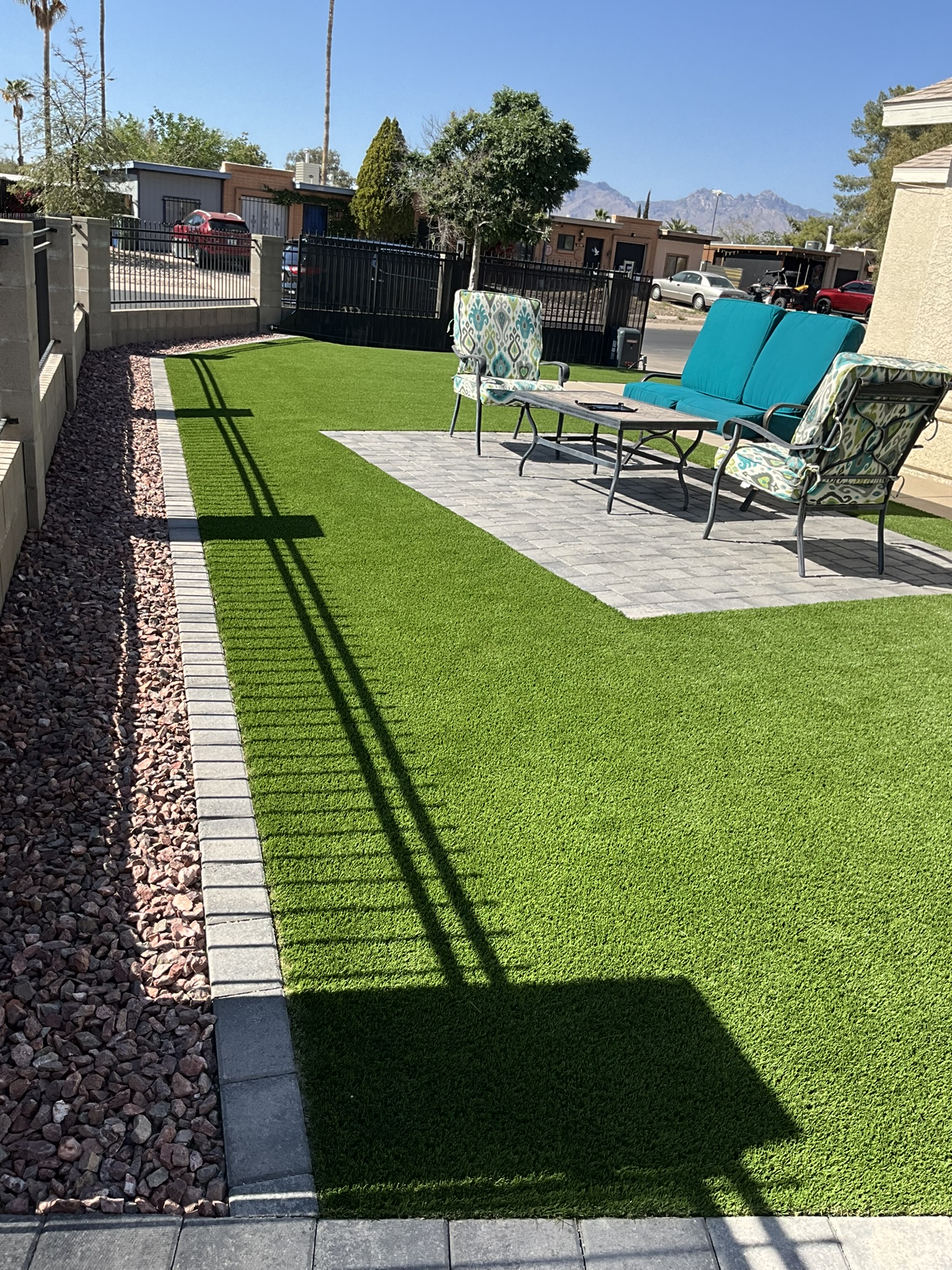 Front yard with pavers and turf