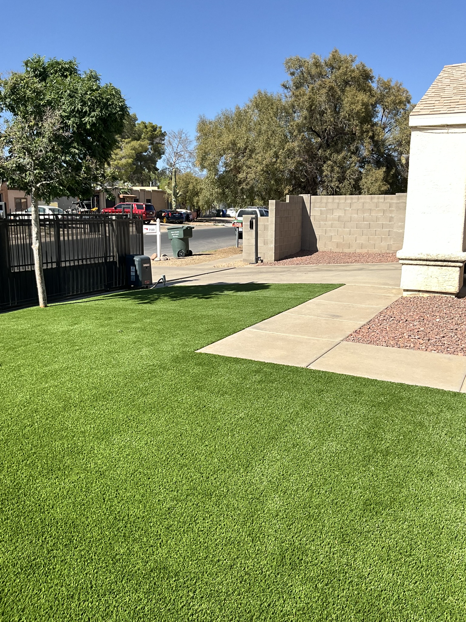 Front yard artificial grass and pavers